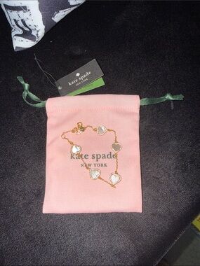 kate spade Gold Heart Link Bracelet with White Inset on Pink Pouch